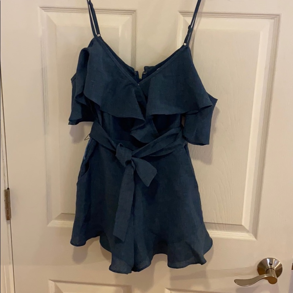 Blue romper with ruffles